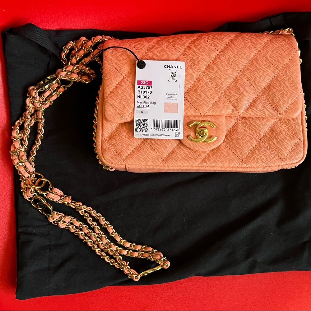 Brand New Light Orange. No box. Comes with dust bag.